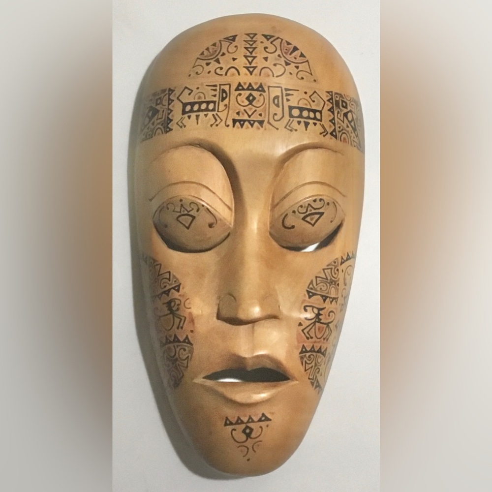 Carved wood tattooed mask